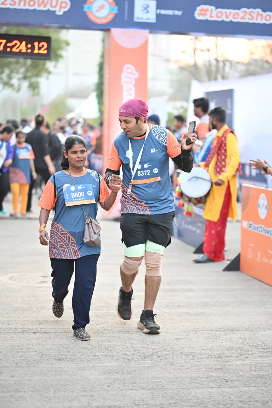 Runners crossing the finish line at Edition 2