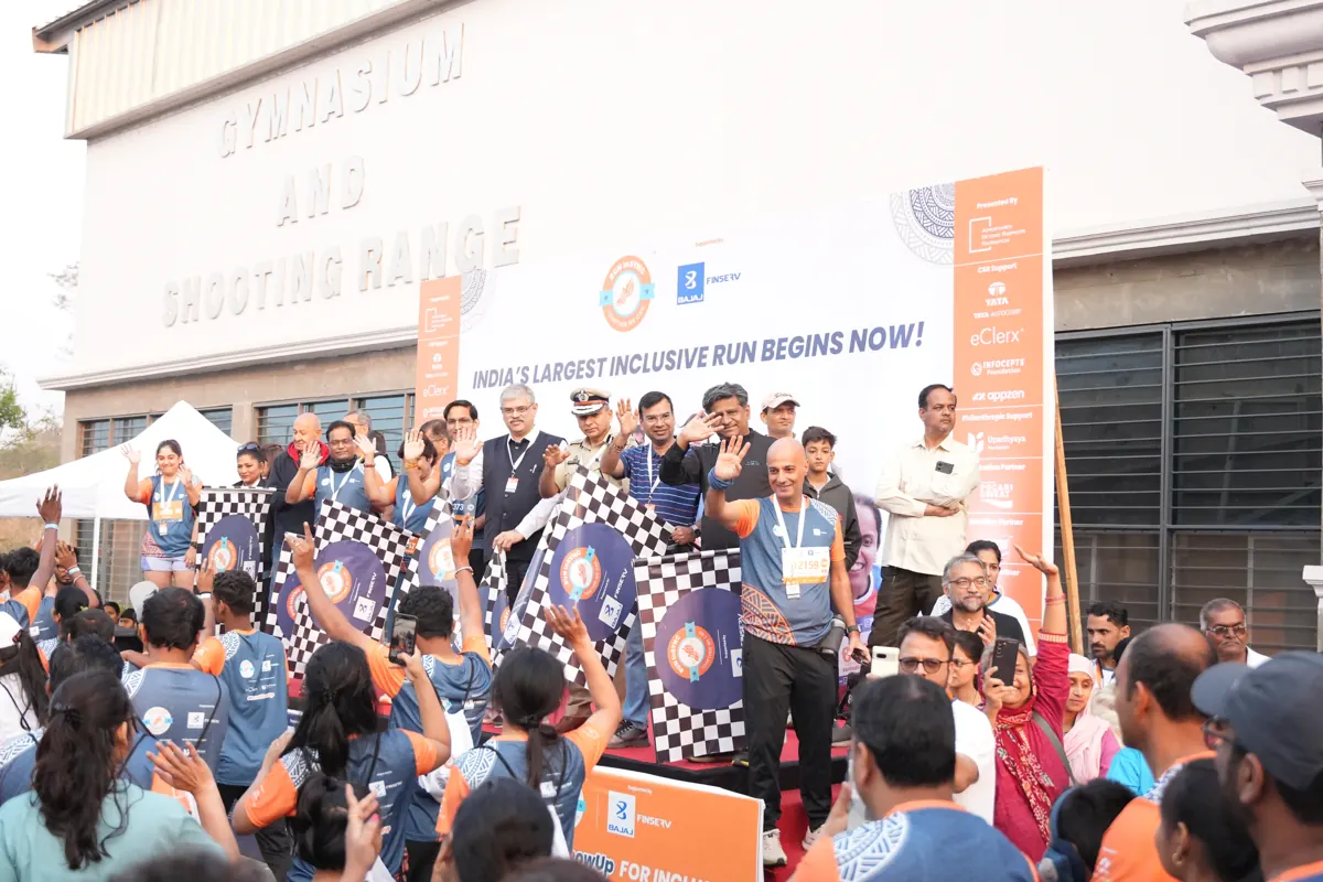 Flag-off of Edition 2 with a packed start line waving chequered flags